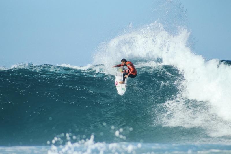 A surfer carving a big wave